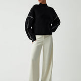 Alma – Pull oversize à col montant et détails piqués